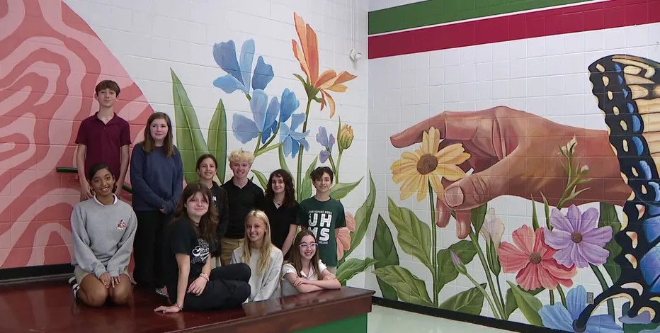Students featured in the FOX 13 News story on new murals at JHMS!